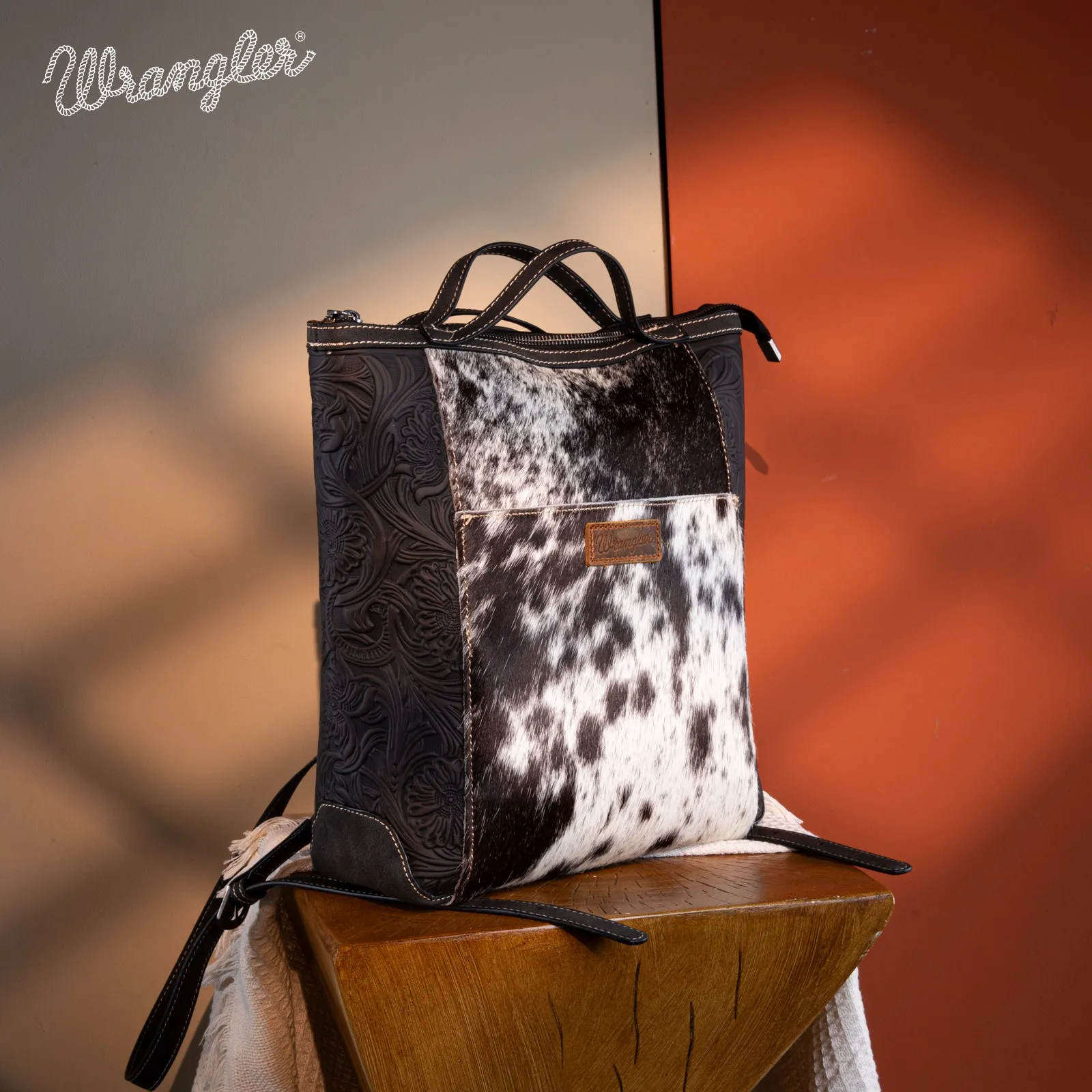 WG169-9112 Wrangler Genuine Hair-On Cowhide Floral Tooled Convertible Backpack/Crossbody - Black)