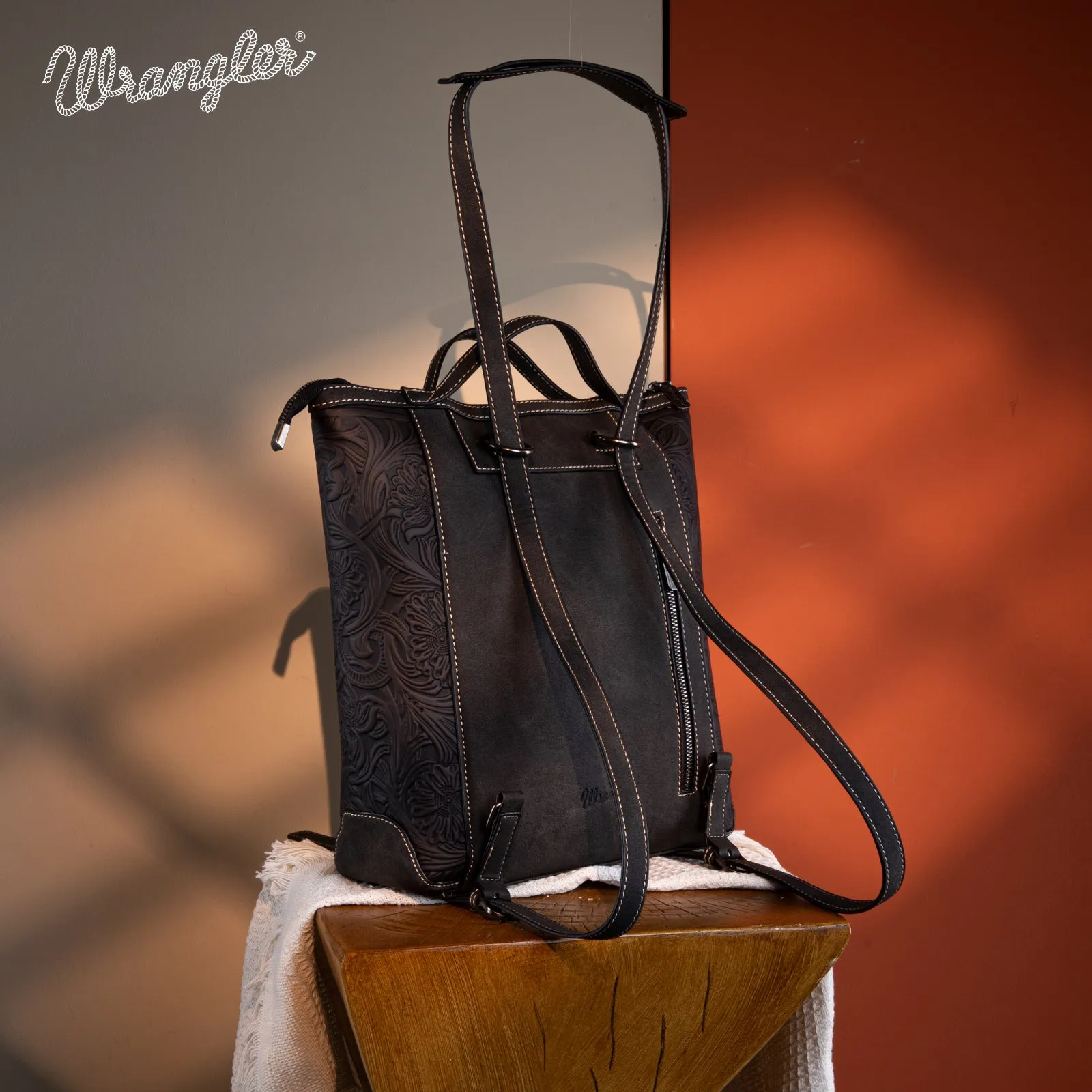 WG169-9112 Wrangler Genuine Hair-On Cowhide Floral Tooled Convertible Backpack/Crossbody - Black)